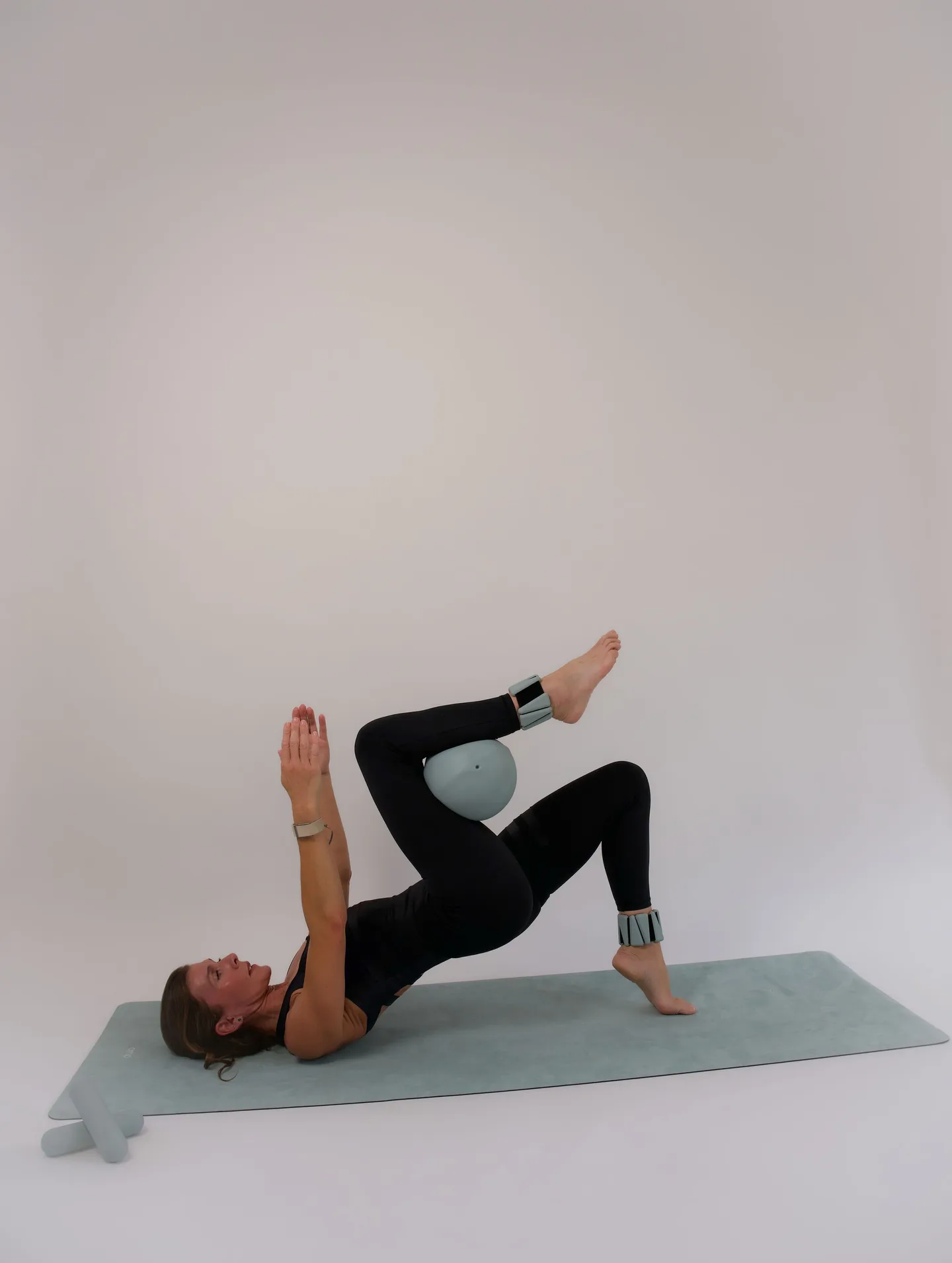 Yoga instructor holding a dumbbell during a personal brand session